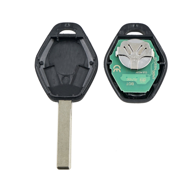 Remote key fob with metal blade, open shell showing internal battery and electronics.