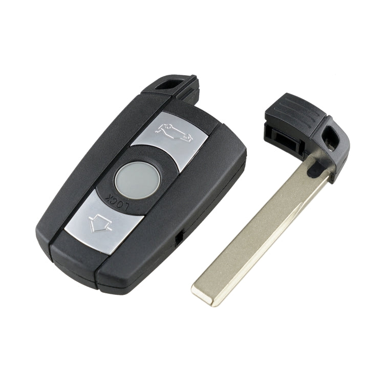 Black key fob with metal key blade removed, showing button icons on silver insert
