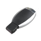 Black remote key fob with silver sides and angled flip blade, compact design