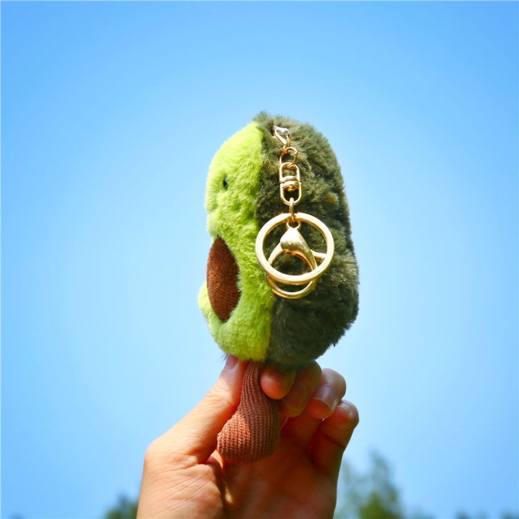 Green plush avocado key ring with metal key loop and chain, side close-up