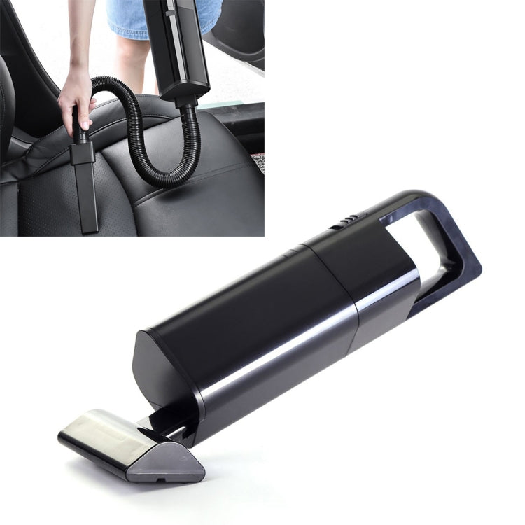 Handheld cordless car vacuum with crevice nozzle, shown near car seat upholstery