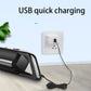 Black handheld vacuum cleaner charging via USB cable and wall outlet