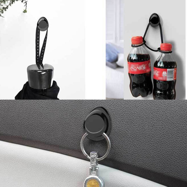 Car mini bag hanger hook with metal ring and straps, shown on seat area