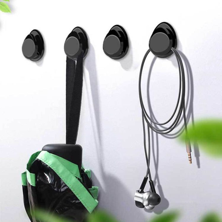 Wall-style display of glossy black car mini bag hanger hooks and ring attachment