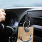 Glossy black car mini bag hanger hook holding a paper shopping bag on dashboard