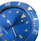 Close-up of blue quartz car watch face with hour markers and silver hour hand