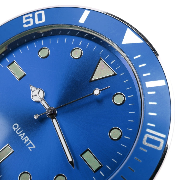 Close-up of blue quartz car watch face with hour markers and silver hour hand