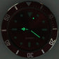 Blue car watch with green luminous dial, glowing dots, and silver markers