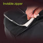 Black lumbar support pillow with hidden zipper opening, close-up of zipper track