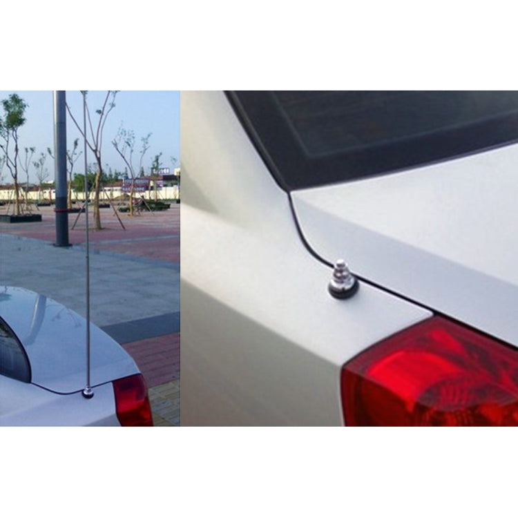 Car roof antenna base and silver mast installed on trunk panel