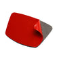 Red protective cover pad over a small molded sticker backing