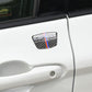 Installed carbon fiber-look B-pillar sticker on a white car door handle area