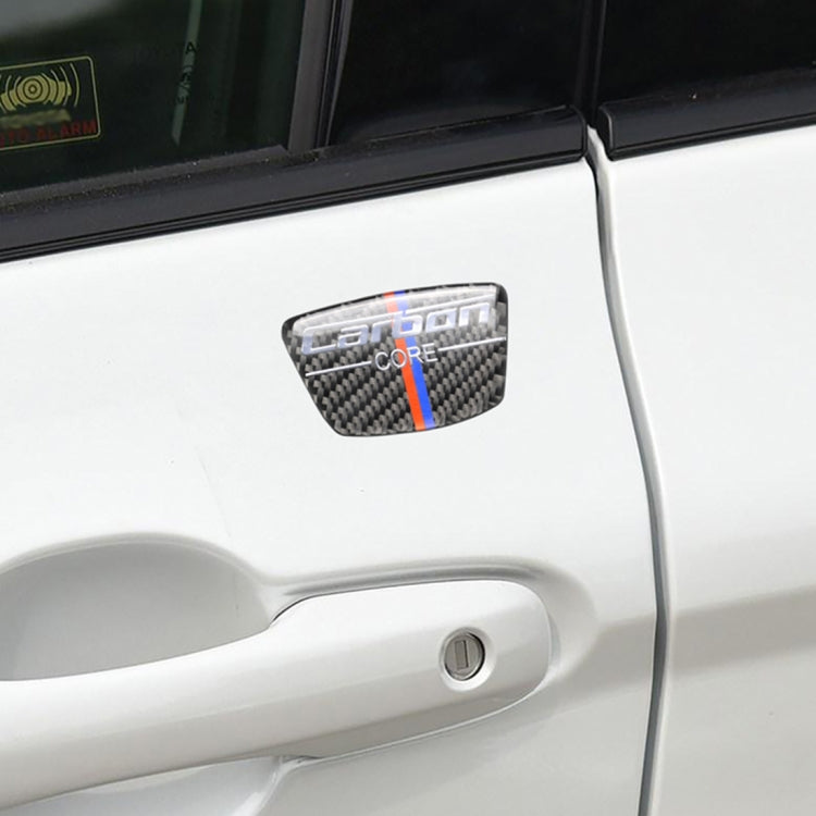 Installed carbon fiber-look B-pillar sticker on a white car door handle area