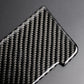 Carbon fiber-look panel sticker close-up, glossy black weave with silver edge