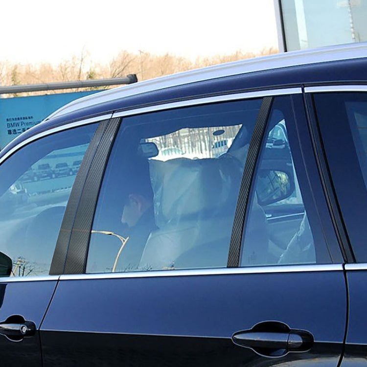 Carbon fiber window B-pillar trim strips, textured black vertical panels on car door