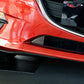 Carbon fiber front bumper decorative sticker on red car near black grille vent