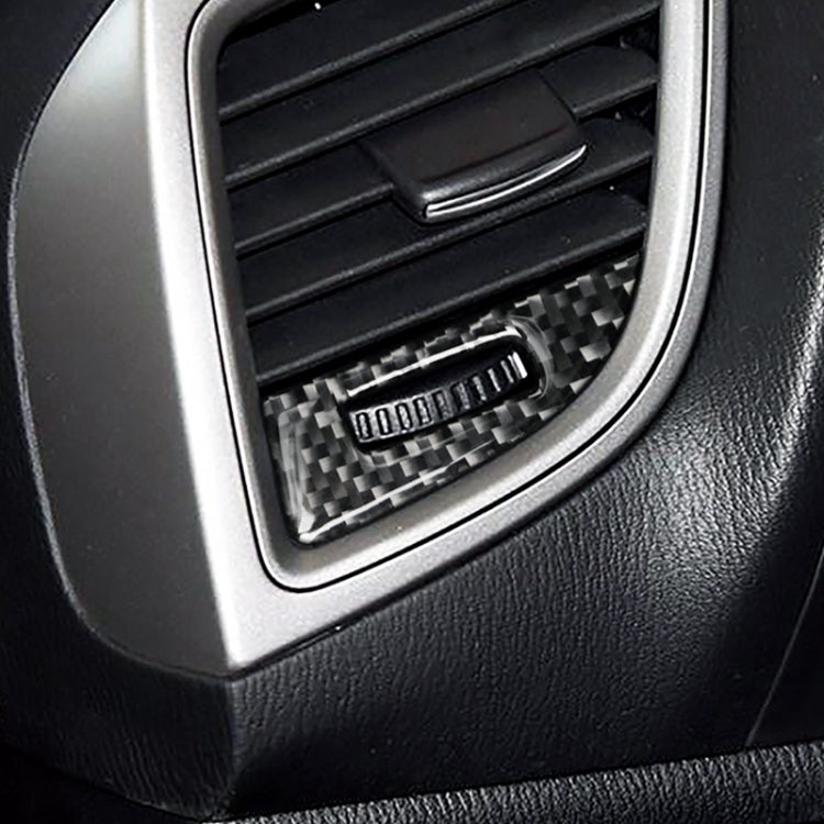 Carbon fiber air vent trim insert installed inside dashboard air outlet surround