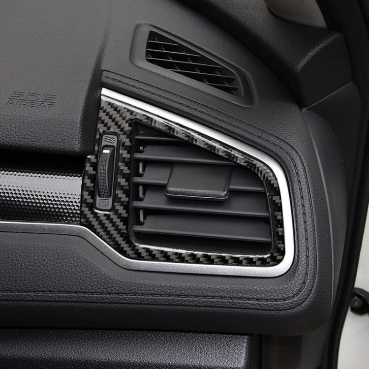 Installed carbon fiber air vent trim surround with inner slats, textured black weave