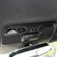Black carbon-fiber dome light panel sticker overlay on car interior trim