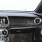 Installed black carbon fiber front passenger central control panel trim with vent ring