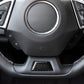 Black carbon fiber style lower steering wheel trim insert below controls