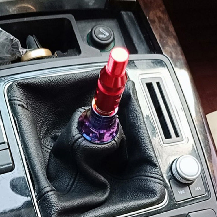 Red threaded gear shift knob adapter installed in a car shifter boot
