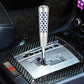Silver shift knob with blue perforation dots and chrome base