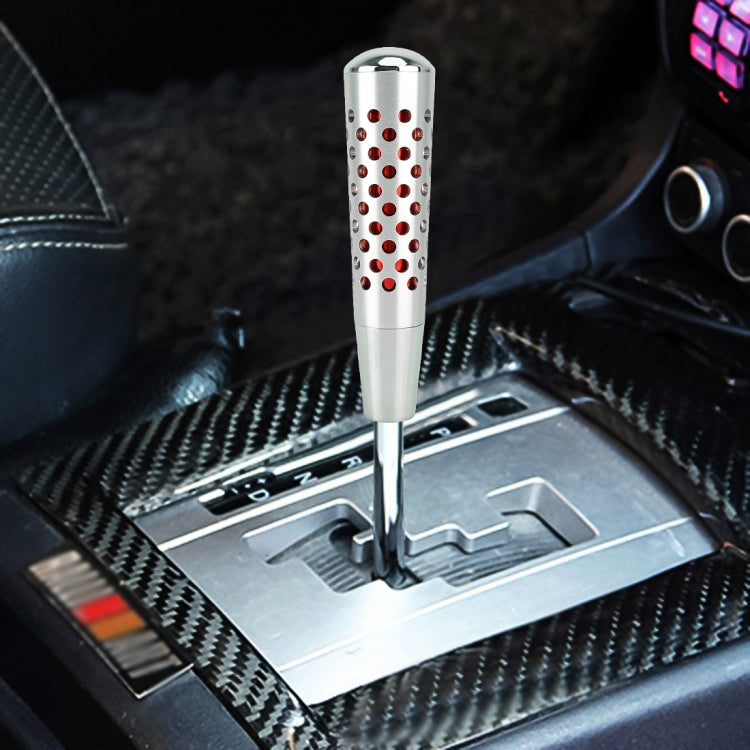 Silver shift knob with perforated mesh sleeve and red dot pattern