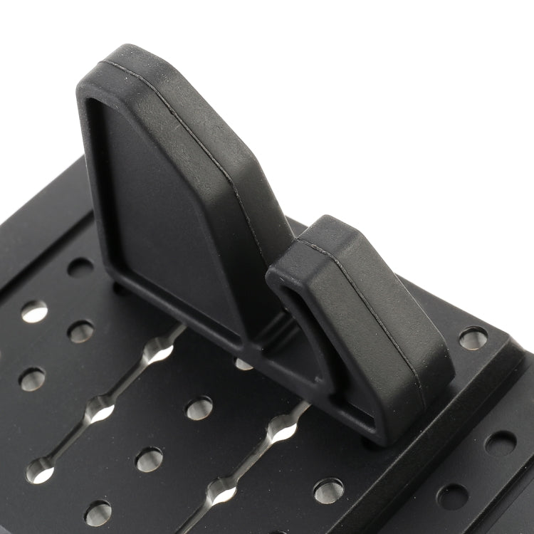 Close-up of black silicone phone holder side arm and mounting plate holes