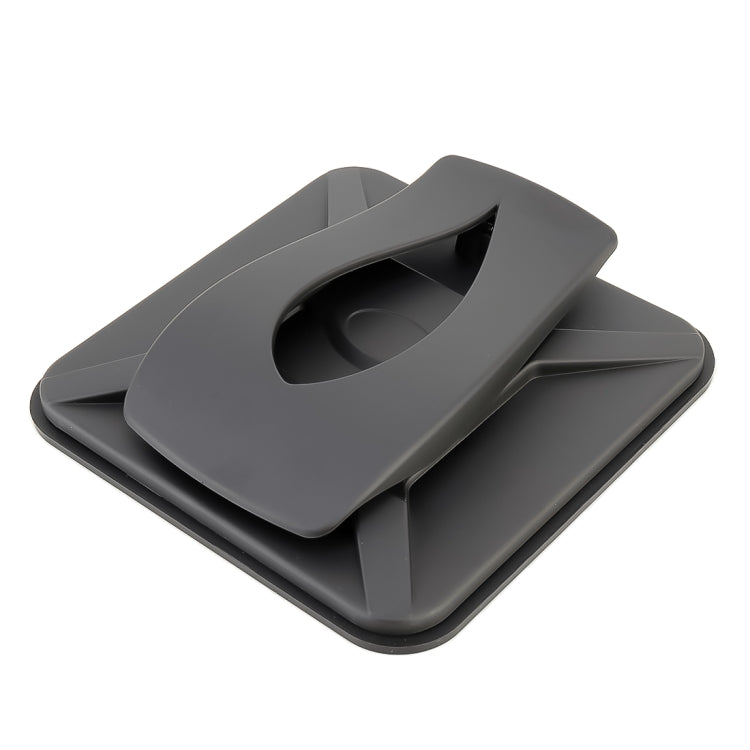 Black dashboard phone holder base with open clamp cradle for securing a phone