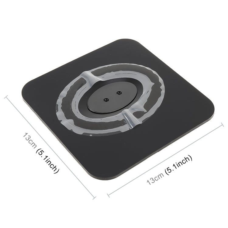 Black dashboard phone holder with circular suction pad on top