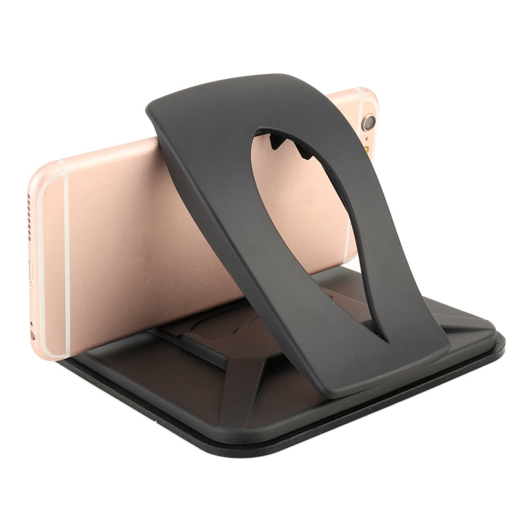 Black dashboard phone holder with cradle grip securing a smartphone