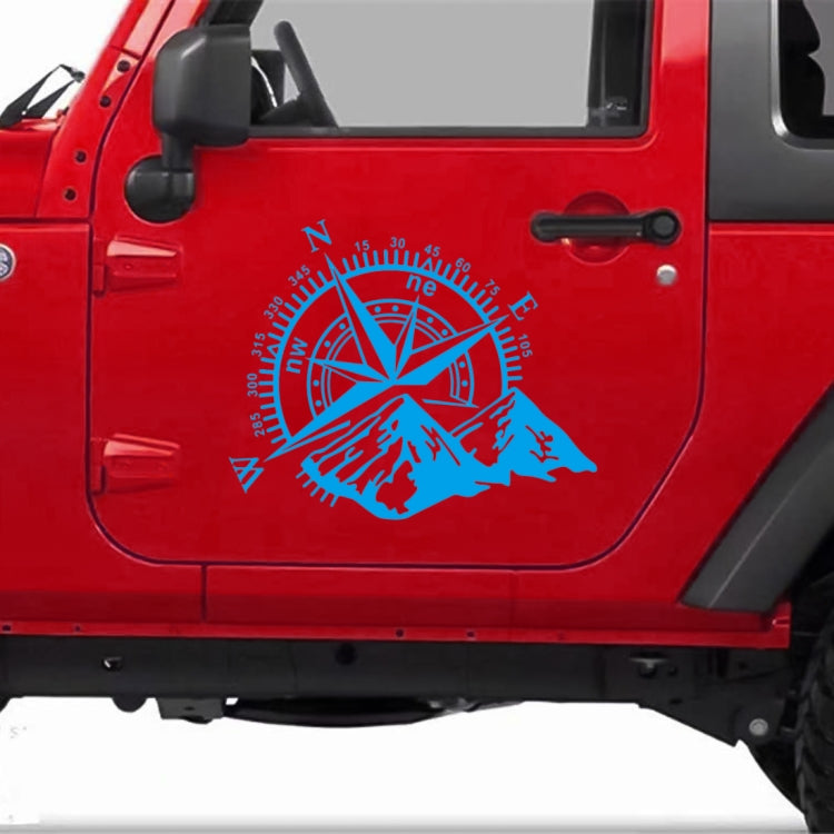 Blue compass rose and mountain PVC car sticker on a red vehicle door