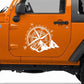 White compass rose and mountain PVC car sticker on an orange vehicle door