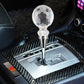 Universal crystal gear shift knob installed on center console with chrome base