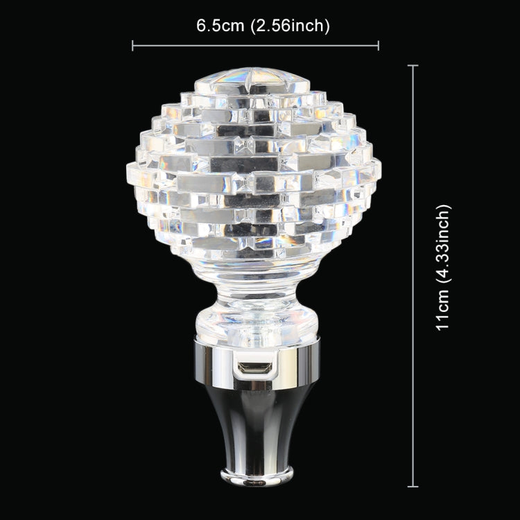 Crystal gear shift knob with faceted clear top and chrome base, vertical profile