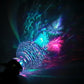 Colorful LED-lit crystal gear shift knob with faceted clear top and chrome stem