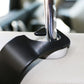 Car back seat hook close-up, black plastic hook on seat with metal rod base