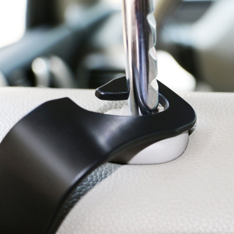 Car back seat hook close-up, black plastic hook on seat with metal rod base