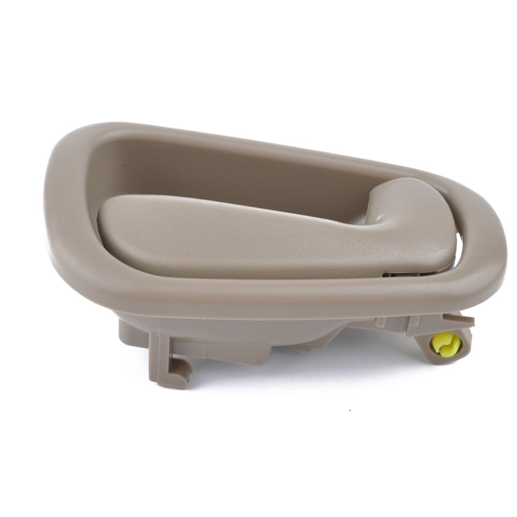 Beige inner door handle with mounting tabs and yellow connector detail