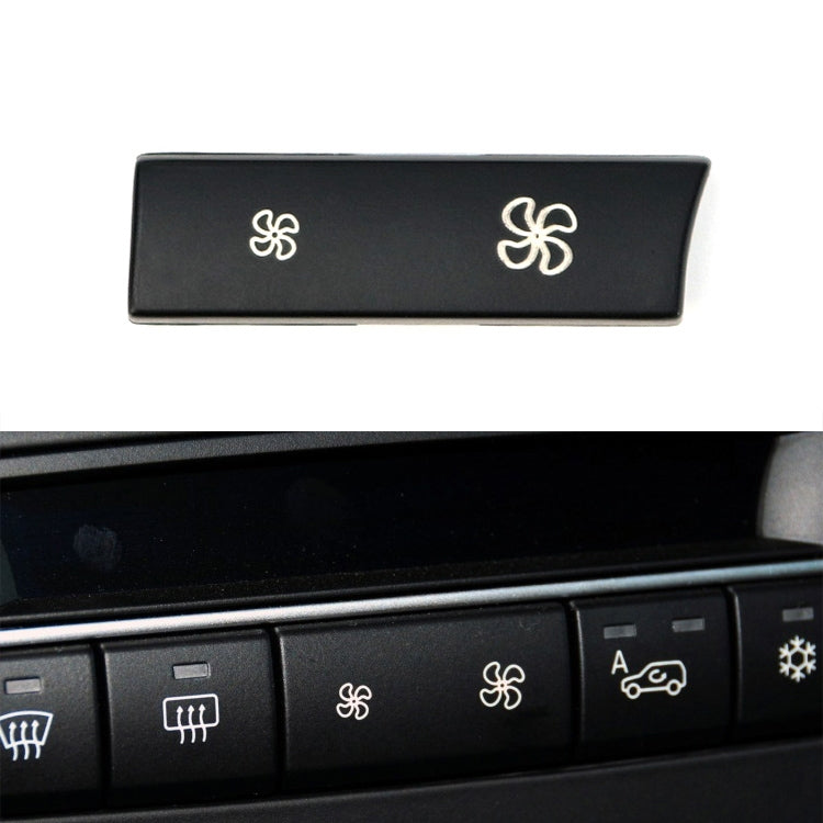 Black dashboard air control button panel with two ventilation icons, right high configuration
