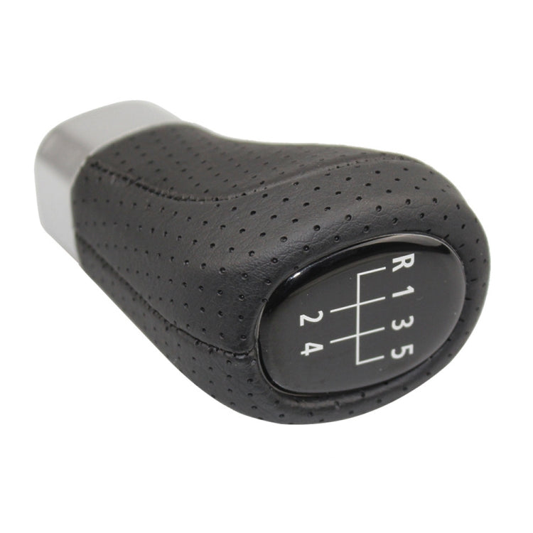 5-speed gear knob with perforated black leather texture and silver base