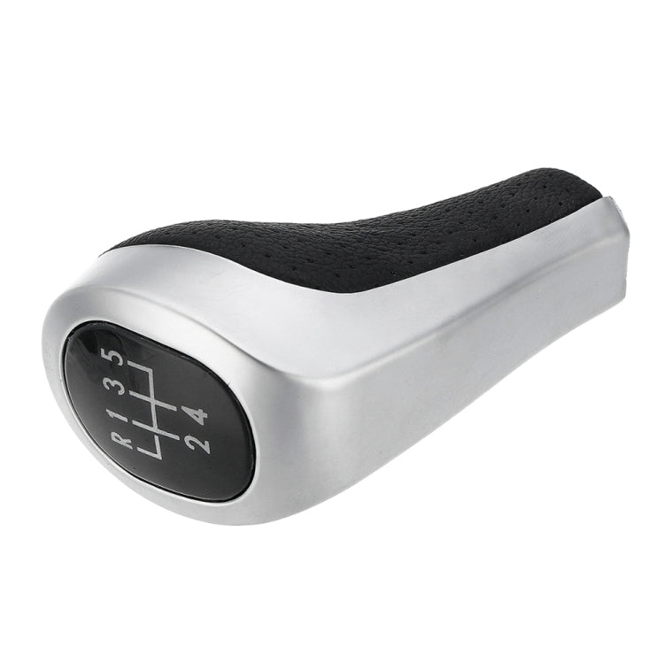 Matte silver gear shift knob with black leather grip and 5-speed gear position markings