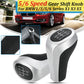 Matte silver 5/6-speed gear shift knob with black leather grip and numbered dial
