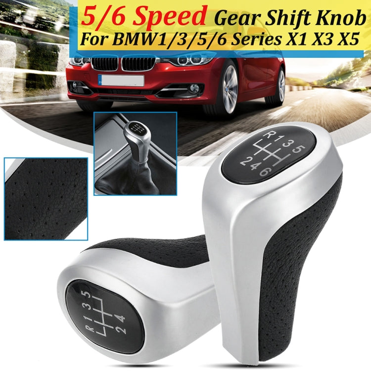 Matte silver 5/6-speed gear shift knob with black leather grip and numbered dial