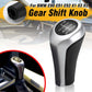 Matte silver gear shift knob with black leather grip and etched shift diagram