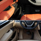 Inner door area with orange/beige trim pieces installed on driver side