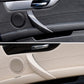 Car interior door handle pull trim inserts, black and beige installed on doors