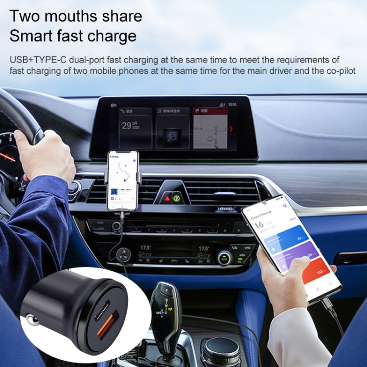 Black dual-port car charger plugged into dashboard for fast charging