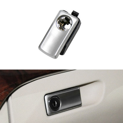 Car glove box handle switch with silver bezel and black key cylinder
